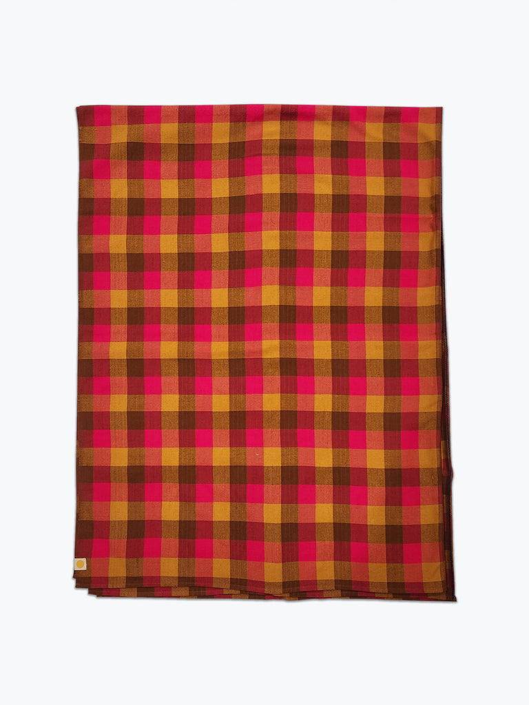 Plaid fabric tablecloth in brown, ochre yellow and pink.