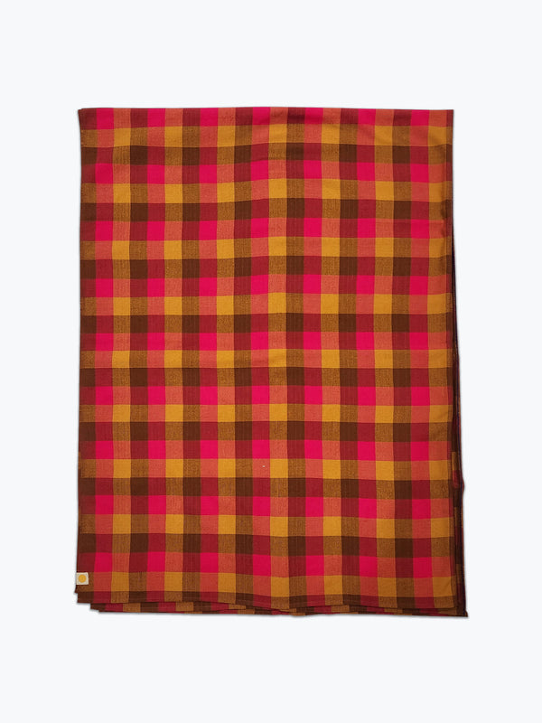 Plaid fabric tablecloth in brown, ochre yellow and pink.