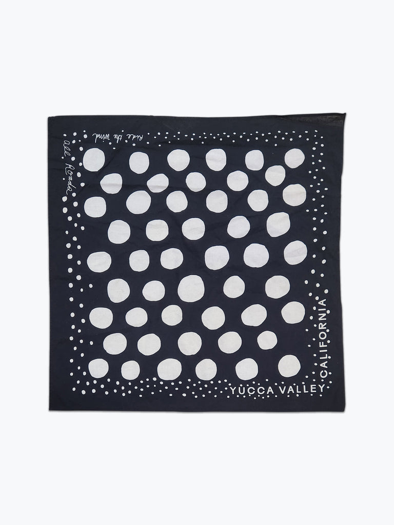 black bandana with white circles.