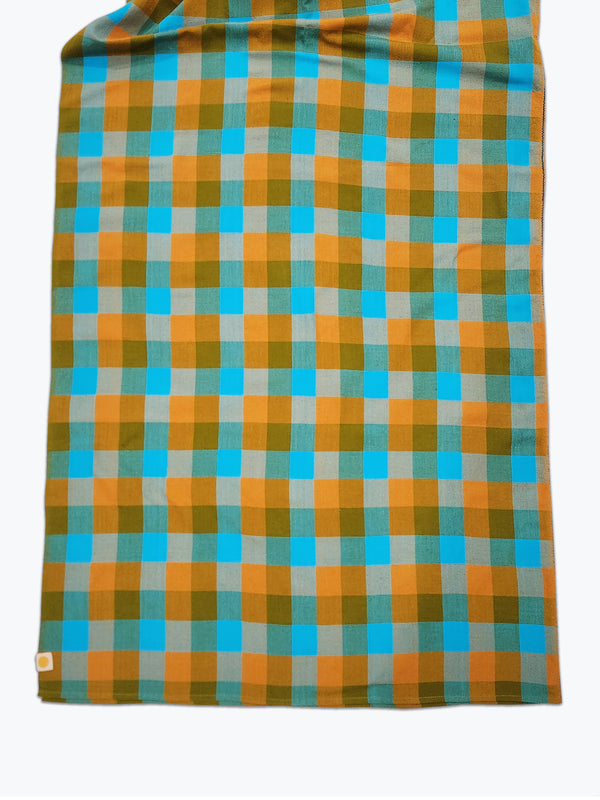 Chunky graphic plaid tablecloth in green, yellow and bright blue.
