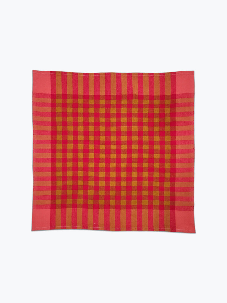 Coral pink and ochre plaid cotton fabric napkins.