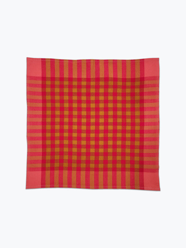Coral pink and ochre plaid cotton fabric napkins.