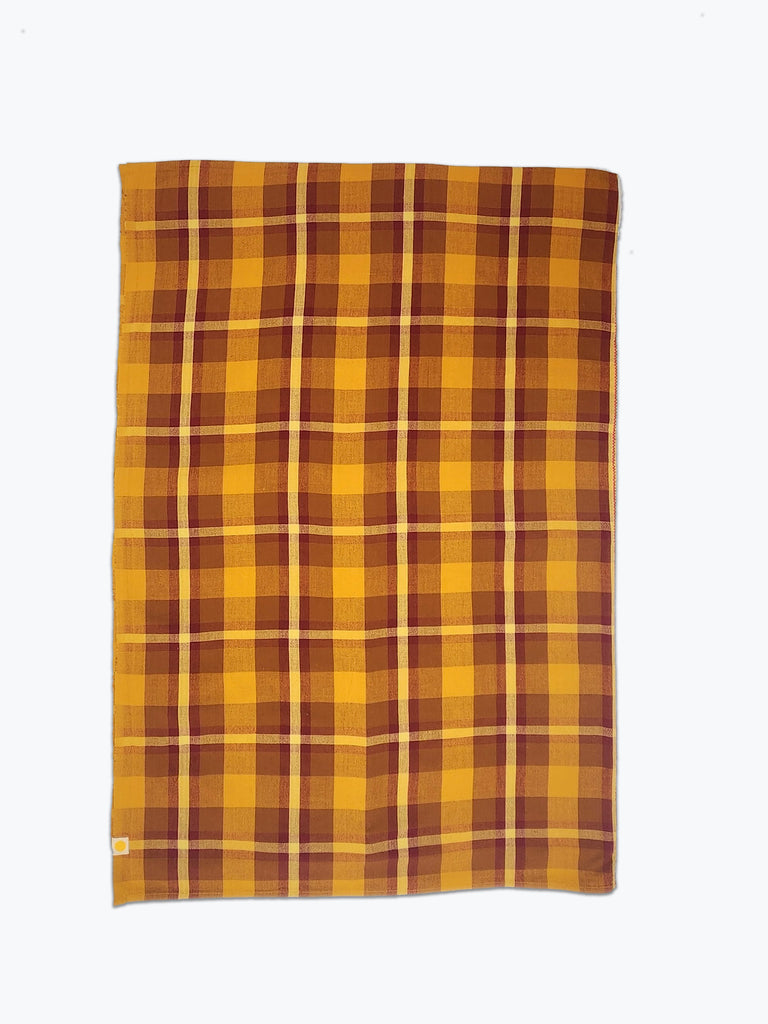 ochre and burgundy plaid tablecloth.