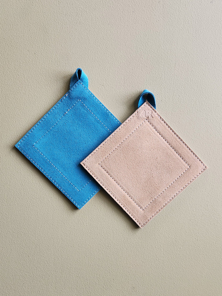 Teal and tan suede leather square potholder. 