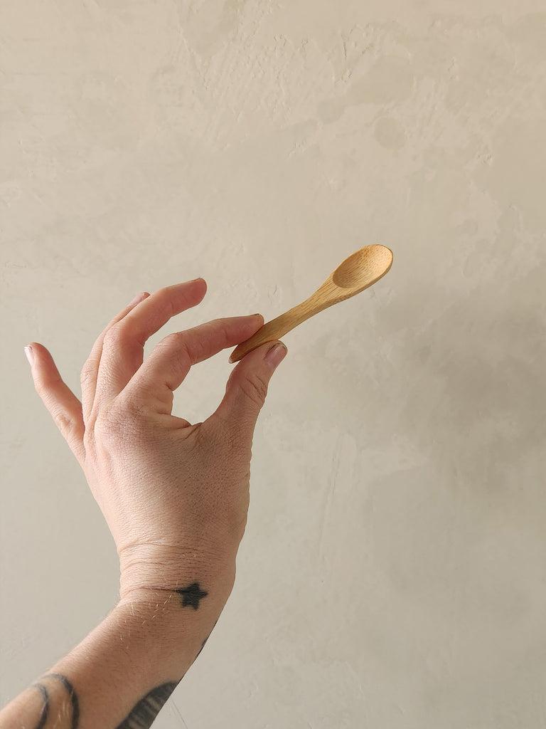 tiny bamboo wood spoon.